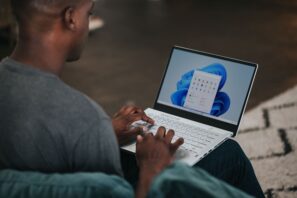 man typing on computer